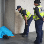 police with homeless person